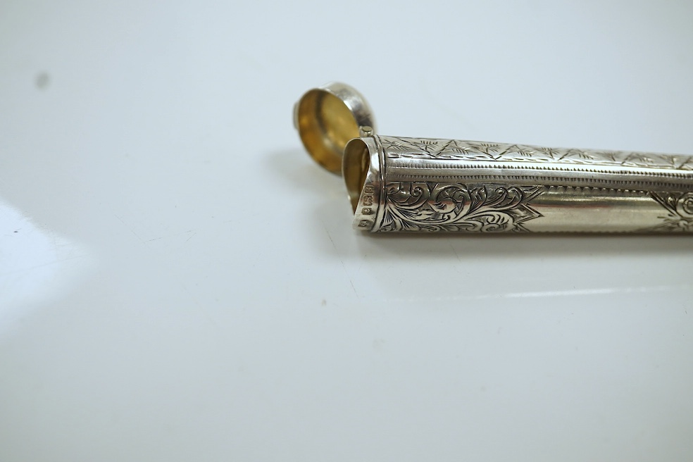 A 9ct gold mounted amber cigarette holder, 78mm, in a silver case. Condition - fair